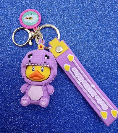 Y&M Брелок Уточка в фиолетовом костюме динозавра