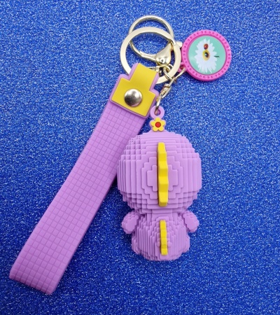 Y&M Брелок Уточка в фиолетовом костюме динозавра